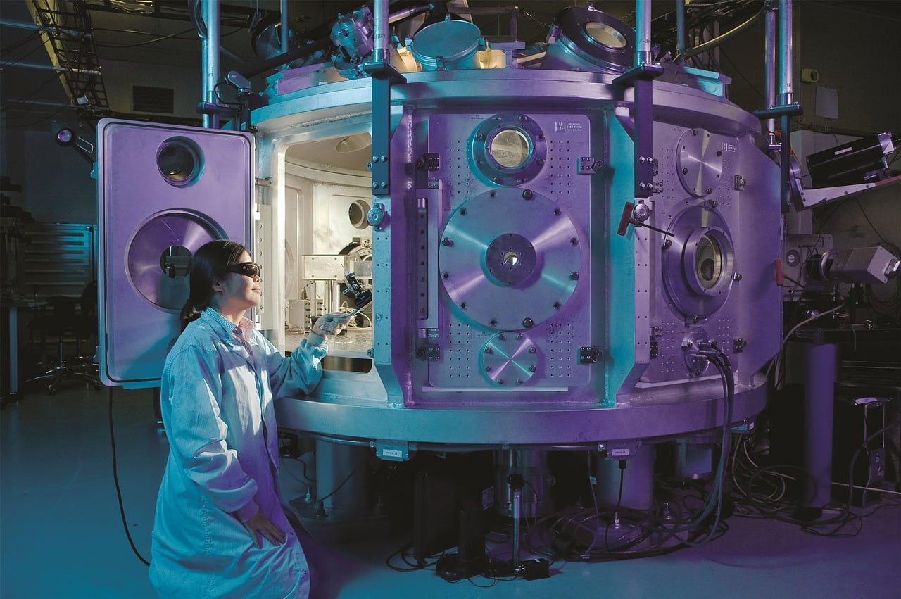 Image of a museum worker inspecting a object given to us as support